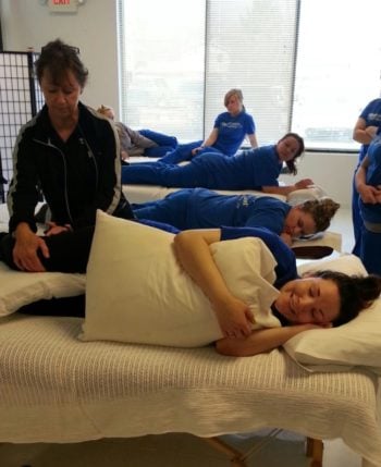 Students are training in massage therapy