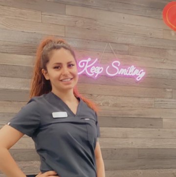 Erica Serna, Dental Assistant is posing outside